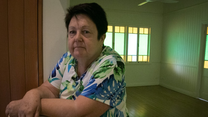 Woman standing in empty house