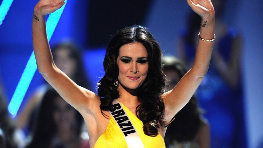 Miss Brazil 2011 Priscila Machado waves after being named second runner-up at the 60th annual Miss Universe beauty pageant