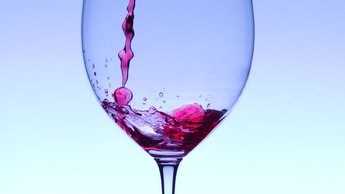 Wine pours into glass