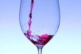 Wine pours into glass