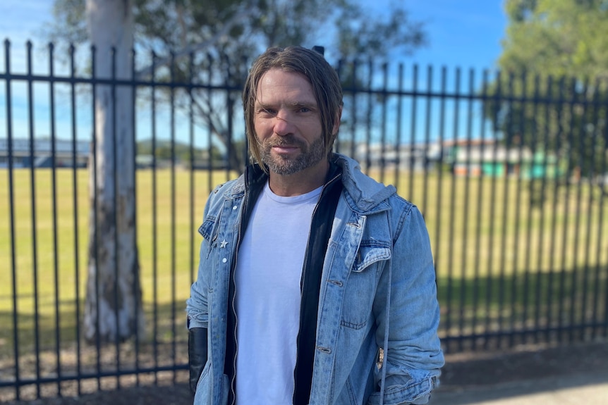 Parent Nate Hamon stands outside Beenleigh State High School.