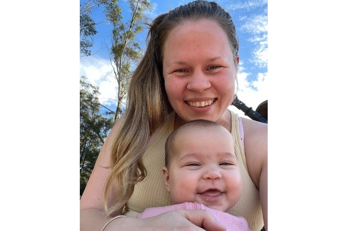 Georgia Walker and child smiling at the camera