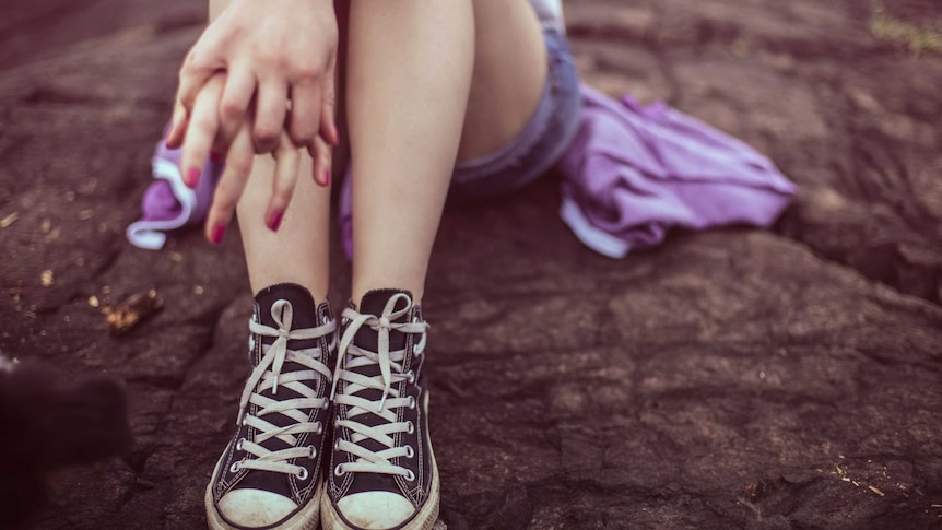 Young woman in sneakers