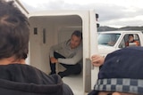 French journalist Hugo Clement in back of police van after arrest at a protest outside Abbot Point coal terminal near Bowen.