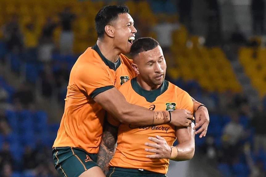 Two Wallabies players celebrate defeating the Springboks.