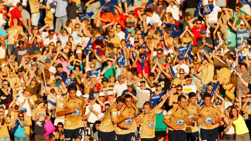 Jets players celebrate after their goal in the preliminary A-League final