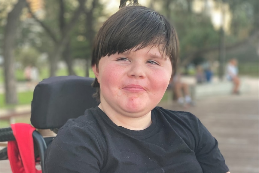 A boy in a wheelchair.
