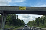 Banner on Sunshine Motorway saying 'Goodbye Clive'