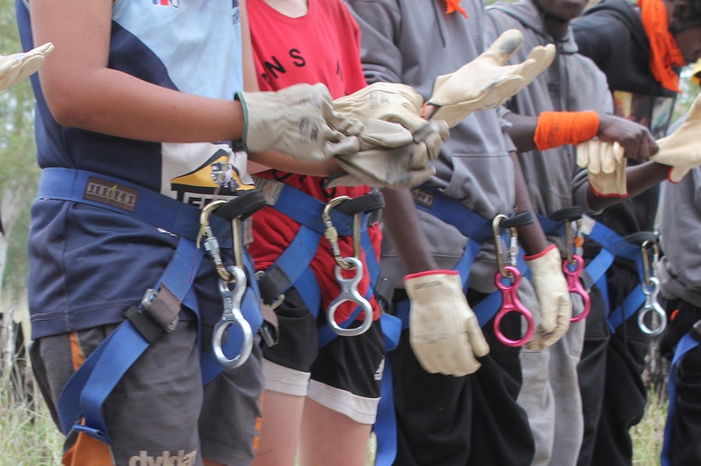 Gloves are on as teens prepare for abseiling at an NT Corrections boot camp.