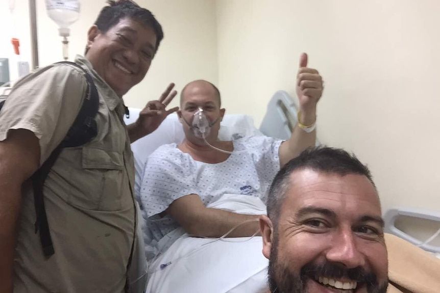 Adam Harvey in hospital after being shot in the neck