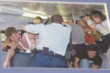 Craig Greenhill's photo of Craig Campbell beating back rioters during the Cronulla riot on Craig Campbell's wall.