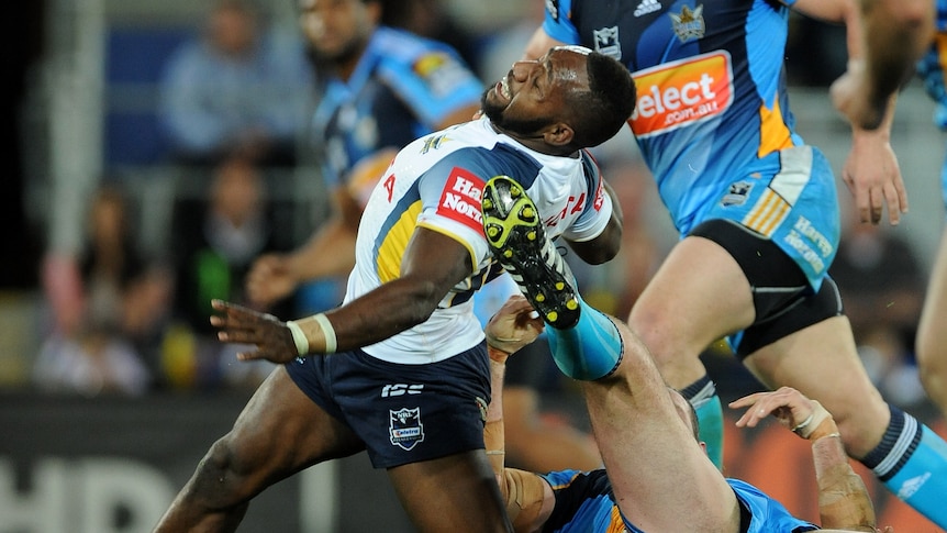 Painful end to the night ... James Segeyaro was helped off the field after just 12 minutes.