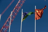 The Chinese and Solomon Islands flags flying near the stadium project.