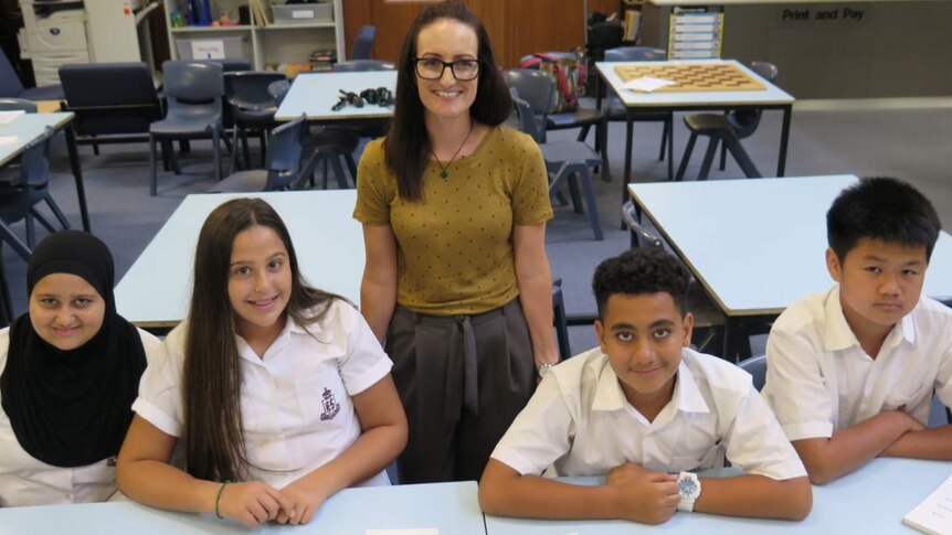 Photo of Kogarah State School teacher Elysha Rogers with four students