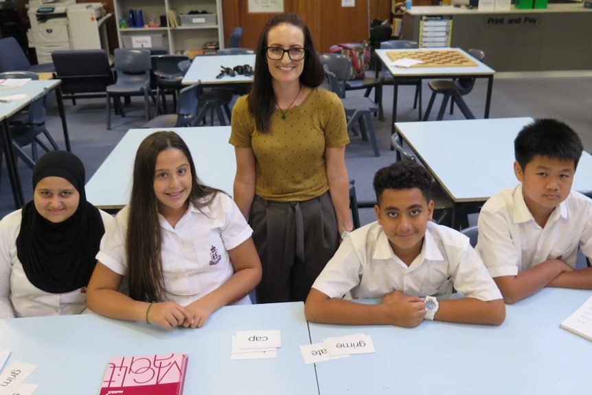 Photo of Kogarah State School teacher Elysha Rogers with four students