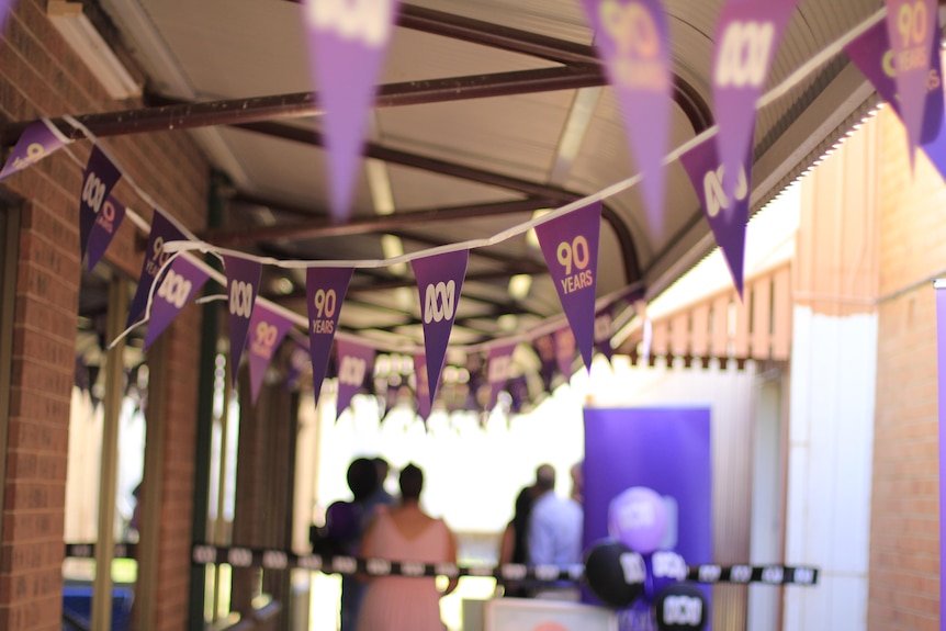 Looking down an alley with purple ABC bunting. 