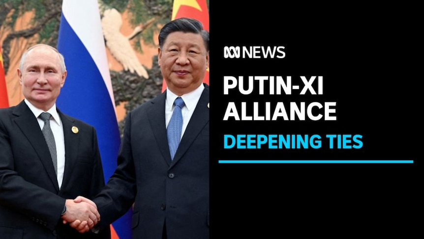Putin-Xi, Alliance: Deepening Ties: Vladimir Putin and Xi Jinping shake hands in front of a Chinese and a Russian flag.