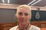 Rebecca Copeland standing in a Parliamentary committee