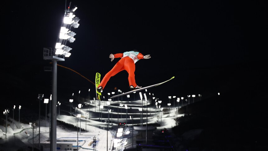 Gregor Deschwanden of Switzerland in action at the 2022 ski jump. 