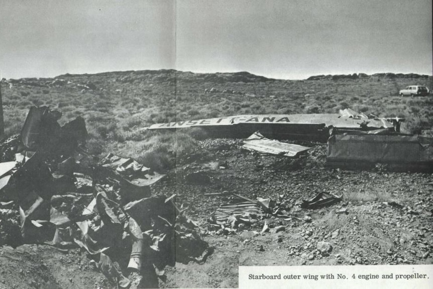 A black and white picture of a plane crash wreckage