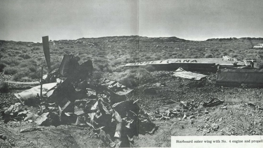 A black and white picture of a plane crash wreckage