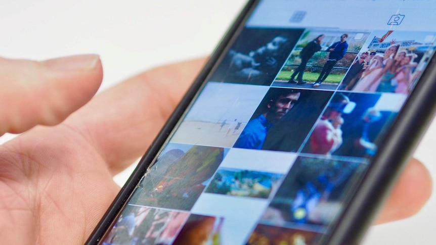 A thumb hangs over an Instagram app