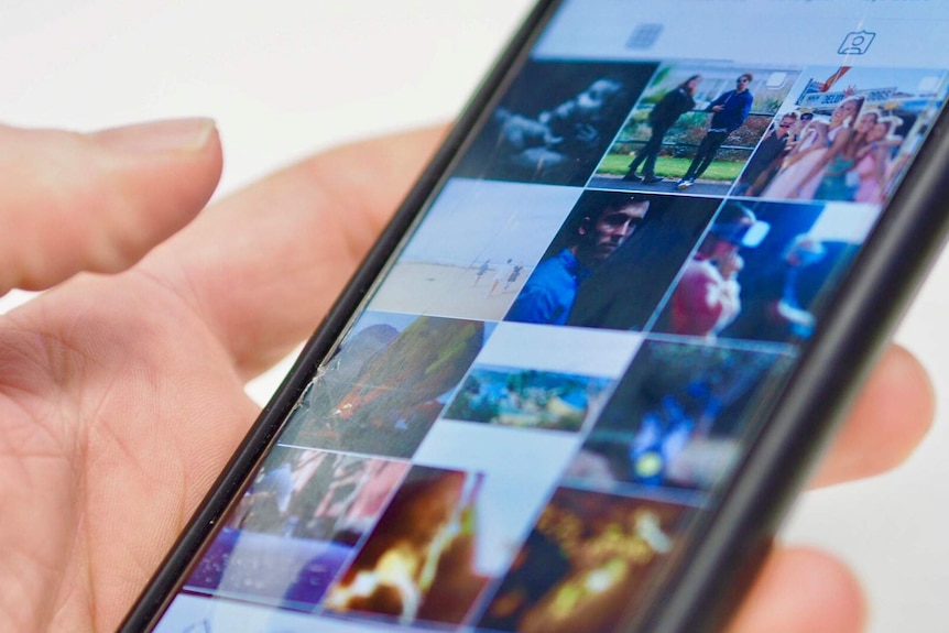 A thumb hangs over an Instagram app