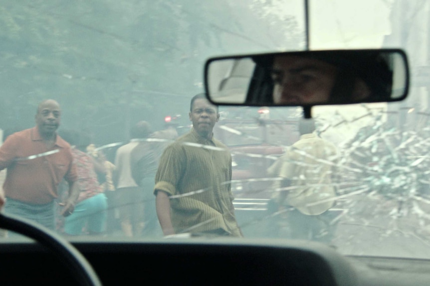 Still image from 2017 film Detroit of rioters on the intersection of West Grand Boulevard at 12th Street in Detroit.