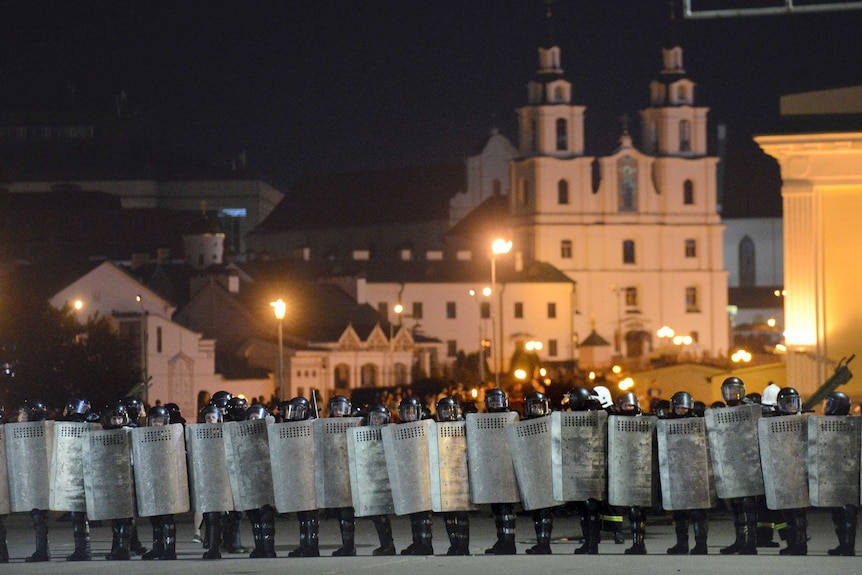 Police block the road to protect against demonstrators after the Belarusian presidential election in Minsk.