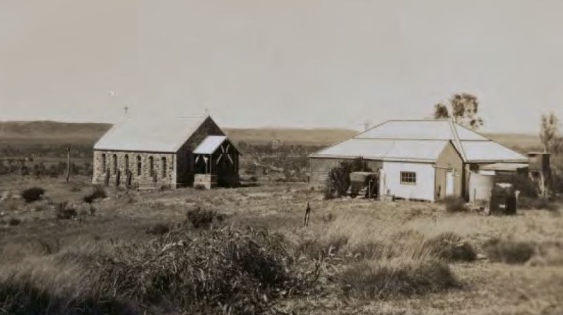 A photo showing the Holy Trinity Church in the background and the rectory at Roebourne in the foreground.