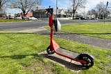 orange e-scooter propped on corner of street in Ballarat CBD 