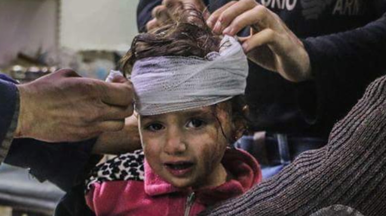 A little girl has head bandages applied