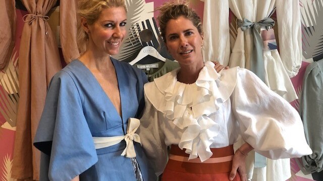 Fashion designers Sarah-Jane Clarke and Heidi Middleton pose together in their store.