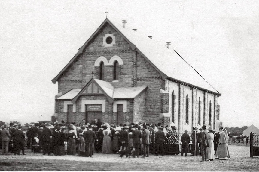 An old black and white photo of a church building. 