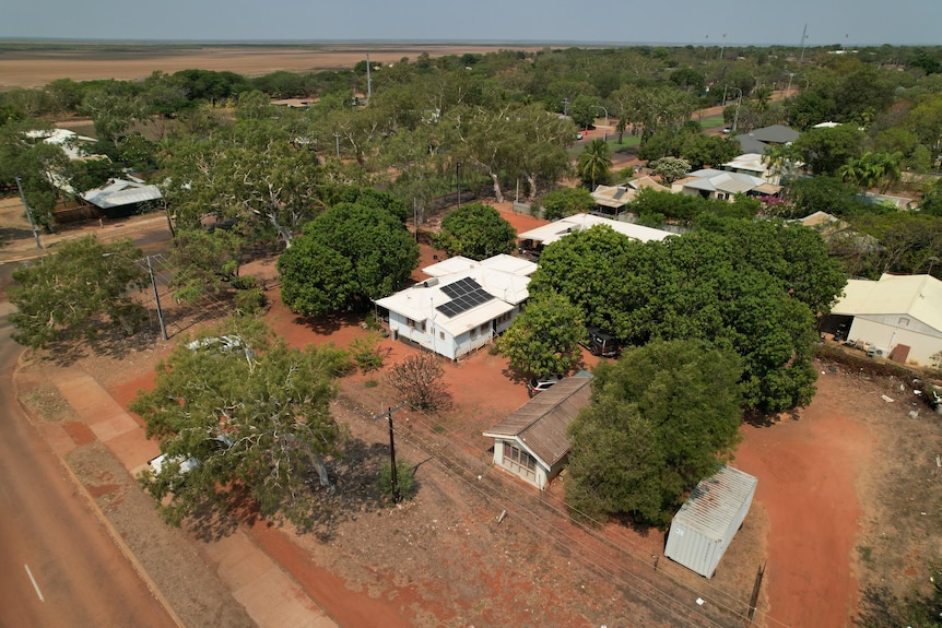 A drone shot of Leonard O'Meara's house, surrounded by red earth and trees.