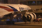 Malaysia Airlines flight MH148 sits on the tarmac at Melbourne Tullamarine Airport.