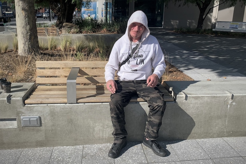 Homeless man Gav, sitting on a bench in Hobart.