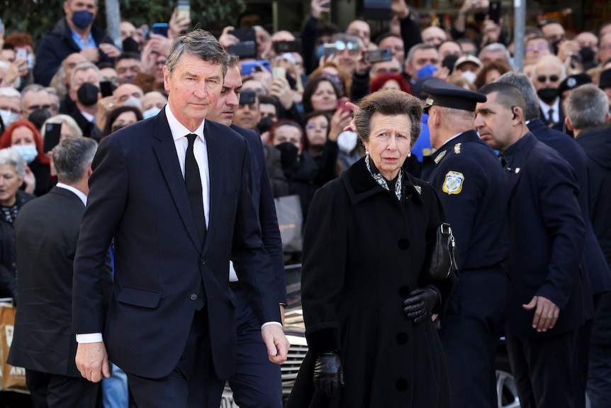 Britain's Princess Anne is pictured wearing black with her husband Vice Admiral Sir Timothy Laurence