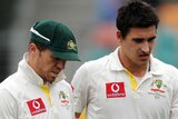 Peter Siddle and Mitchell Starc discuss tactics during the first Test against Sri Lanka.