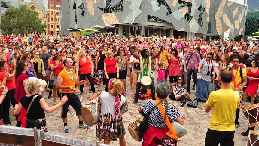 Hundreds of people dance in Melbourne's Federation Square