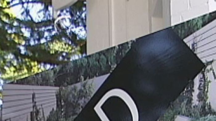 A sold sign erected outside a house