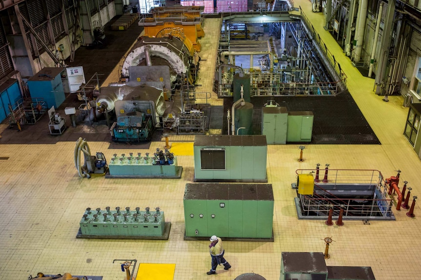 Steve "Weeds" Wheadley makes his way through the turbine hall inside Hazelwood power station