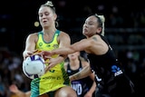 Jamie-Lee Price catches the ball under pressure from a New Zealand opponent
