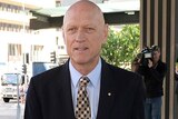 Former Federal Environment minister Peter Garrett arrives at the Magistrates Court in Brisbane on Tuesday.