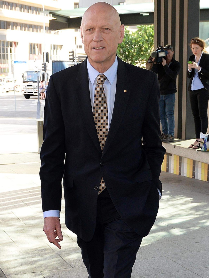 Former Federal Environment minister Peter Garrett arrives at the Magistrates Court in Brisbane on Tuesday.