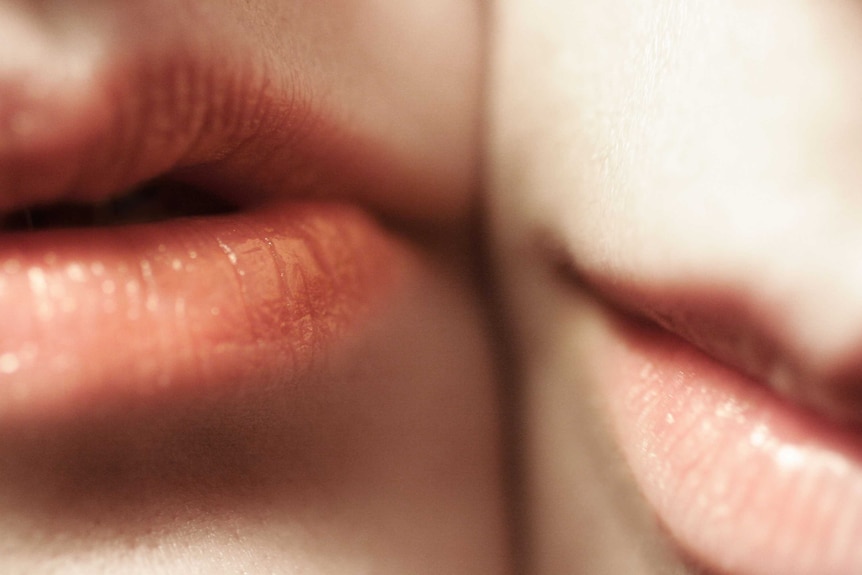 Close up of pair of lips to depict intimacy.