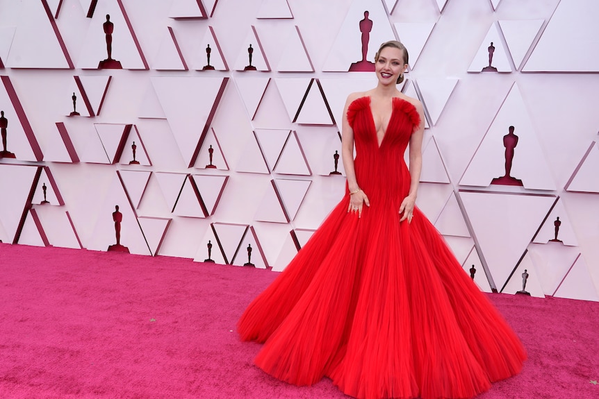 Amanda Seyfried in a floor length red gown