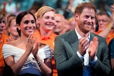 Meghan and Harry applauding 