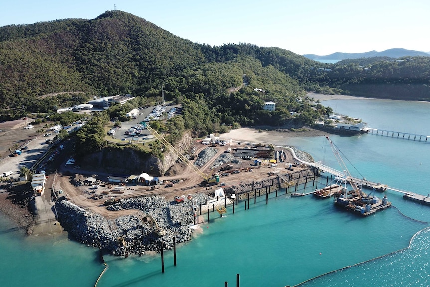 an aerial view of a harbour and seawall under construction