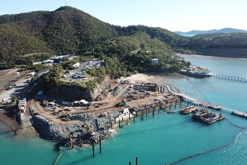 an aerial view of a harbour and seawall under construction